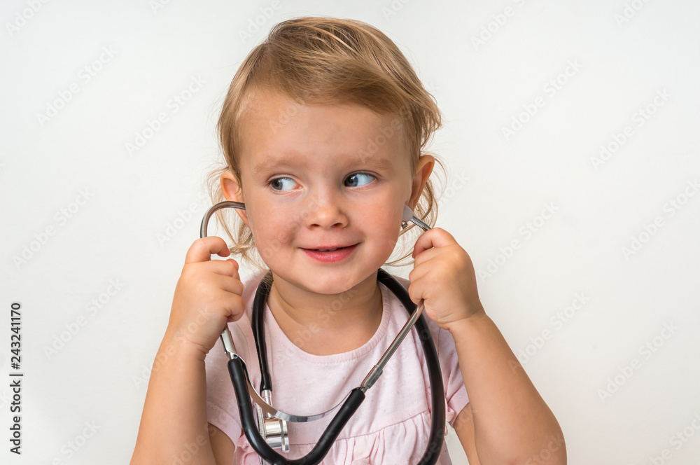 Little baby plays doctor with stethoscope Little baby plays doctor with stethoscope