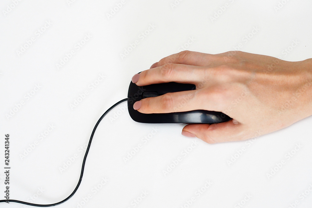 female hand holding computer mouse on white background female hand holding computer mouse on white background