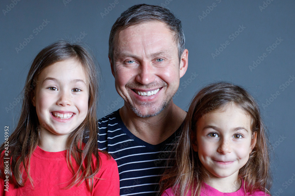 family photo dad with two young daughters family photo dad with two young daughters