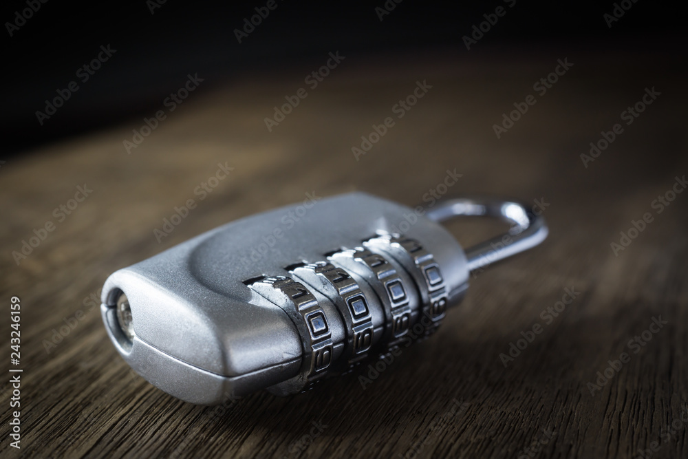 Number digits code key lock on table, dim light. Number digits code key lock on table, dim light.