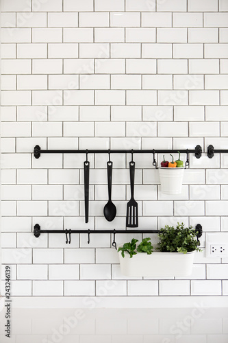 Canvas Print kitchen utensil hanger on white brick wall