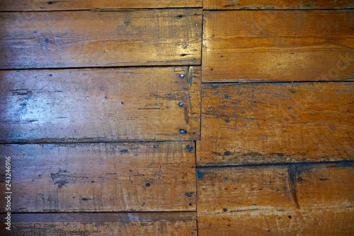 Obraz na plátně Old wood floors set in an uneven pattern, with nails showing