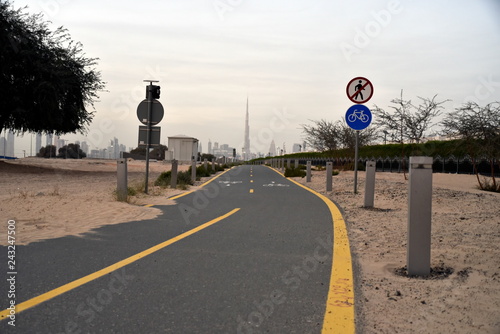 Dubai skyline from Nad Al Sheba bicycle track road, Dubai, United Arab Emirates photo