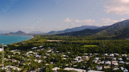 Aerial view on Palm Cove, suburbean town situated on the ocean side with tropical vegetation in Cairns, Queensland, Australia