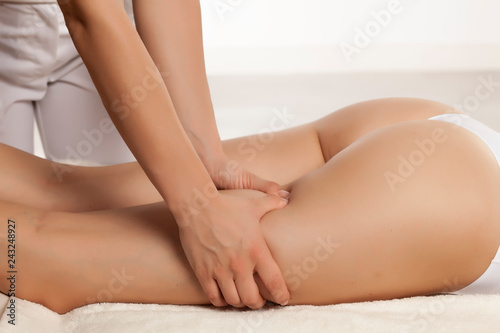 anti-cellulite massage on the legs of young women