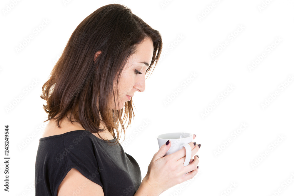 Portrait of beautiful young woman drinking a cup of tea looking mug Portrait of beautiful young woman drinking a cup of tea looking mug