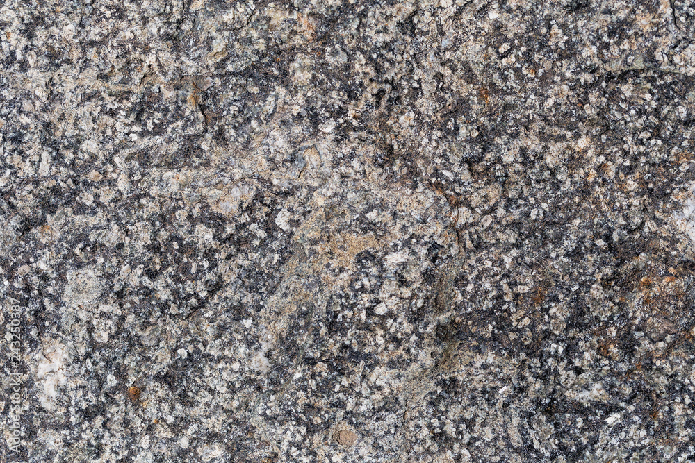 a fragment of a small area granite tiles as a background a fragment of a small area granite tiles as a background