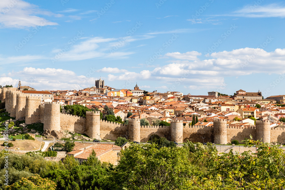 Panoramic view of the historic city of Avila from the Mirador of Cuatro Postes, Spain, with its famous medieval town walls. UNESCO World Heritage. Called the Town of Stones and Saints Panoramic view of the historic city of Avila from the Mirador of Cuatro Postes, Spain, with its famous medieval town walls. UNESCO World Heritage. Called the Town of Stones and Saints