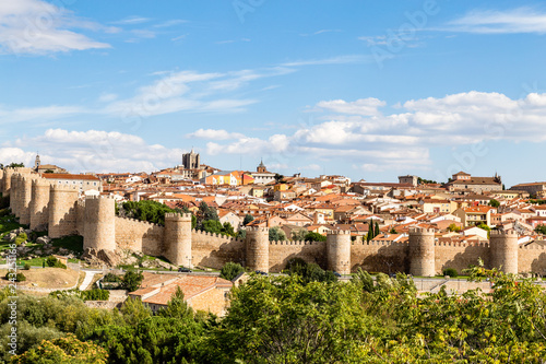 Panoramic view of the historic city of Avila from the Mirador of Cuatro Postes, Spain, with its famous medieval town walls. UNESCO World Heritage. Called the Town of Stones and Saints