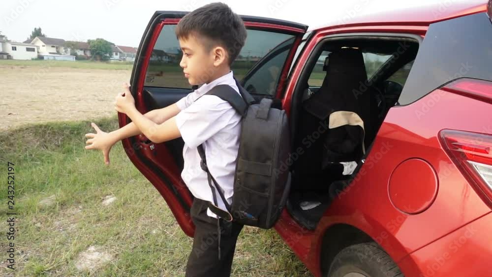Little boy going out of the car to school Little boy going out of the car to school