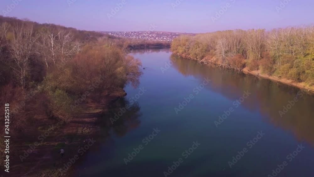Slow drone flight over blue river and agricultural lands. Dniester river, Moldova republic of. 4K birds eye view Slow drone flight over blue river and agricultural lands. Dniester river, Moldova republic of. 4K birds eye view