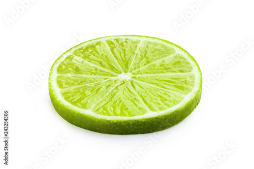Ripe slice of green lime, isolated on white background