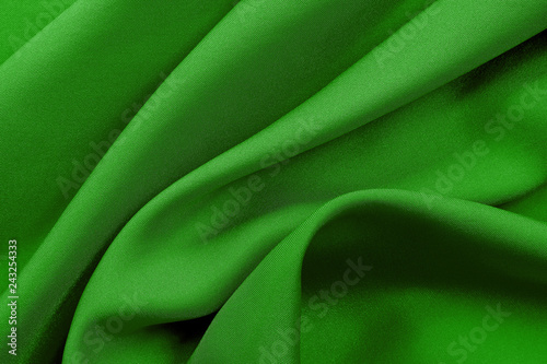 Green fabric texture for background and design, beautiful pattern of silk or linen.