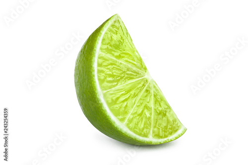 Ripe slice of green lime, isolated on white background