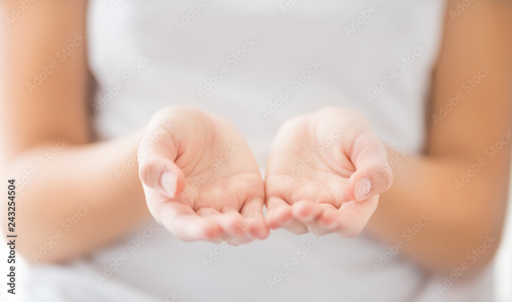 Empty young woman hand - charity care or poverty concept Empty young woman hand - charity care or poverty concept