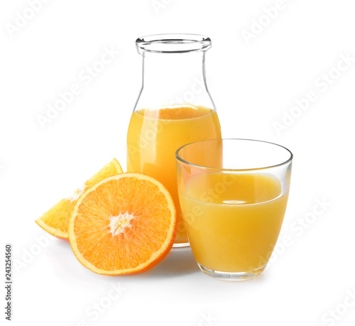 Glass and bottle of fresh orange juice on white background
