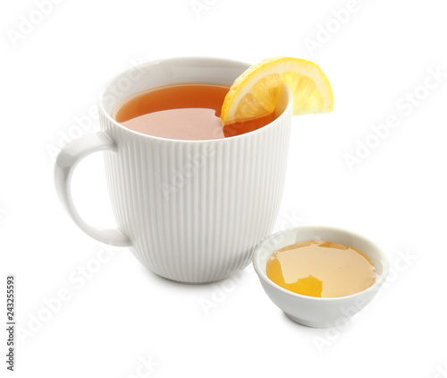 Cup of hot tea with lemon and honey on white background