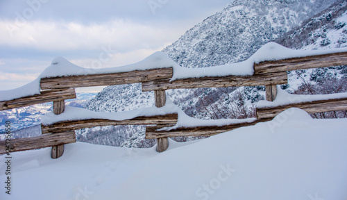 Wooden fence with snow
