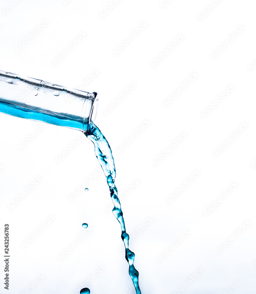 water pouring out of a glass bottle water pouring out of a glass bottle