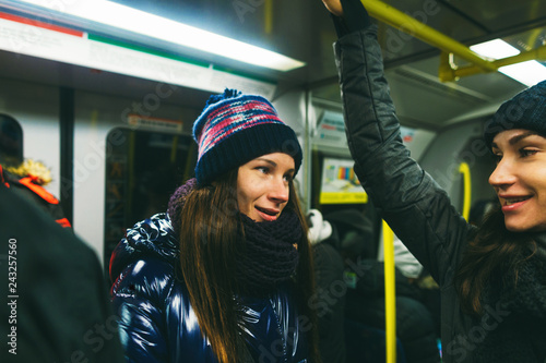 Photography Two young women girlfriends talking subway Stockholm Sweden