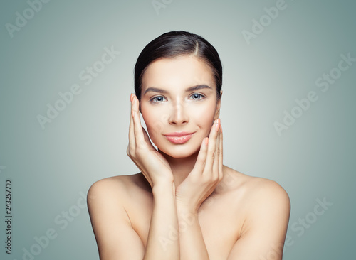 Young healthy woman with clear skin, facial treatment and healthcare concept