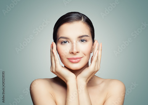 Young smiling woman. Cute face, perfect skin. Ckincare concept