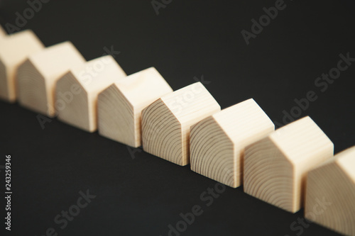 Row of many wooden houses on dark background