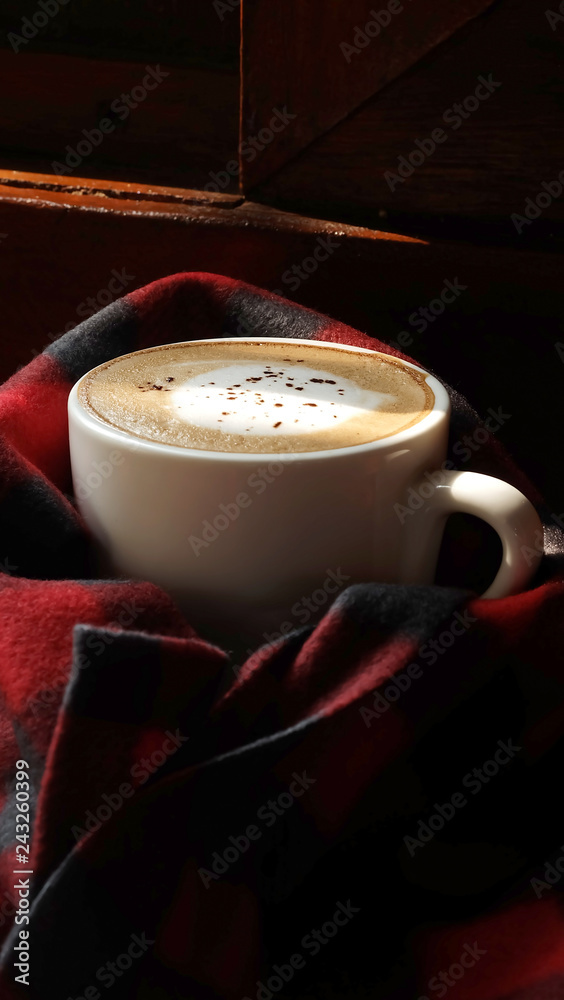 Special recipe hot latte on red cloth and sunlight with space for write wording served in a restaurant, popular drink for meeting place, value added, coffee business is very big and fast growing Special recipe hot latte on red cloth and sunlight with space for write wording served in a restaurant, popular drink for meeting place, value added, coffee business is very big and fast growing