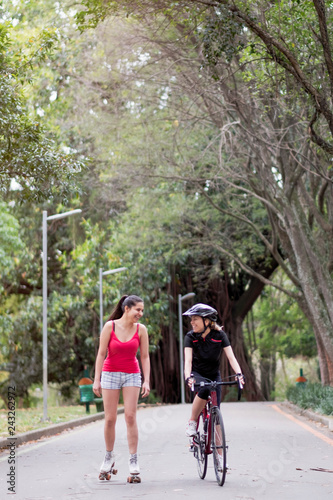 Two sporty young women talking together in Ibirapuera park