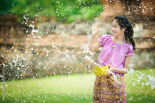 Photography thai girl playing water in song kran festival at ayuthaya in thailand