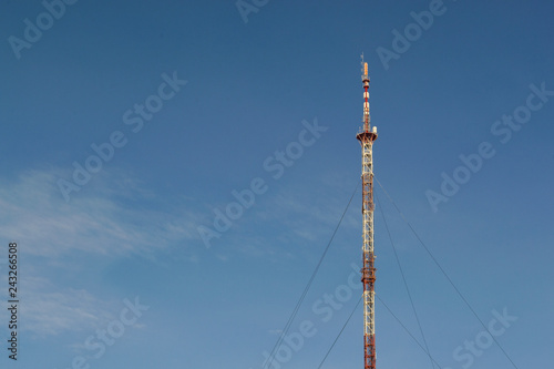 Antenna in the blue sky. Tower in the sky.