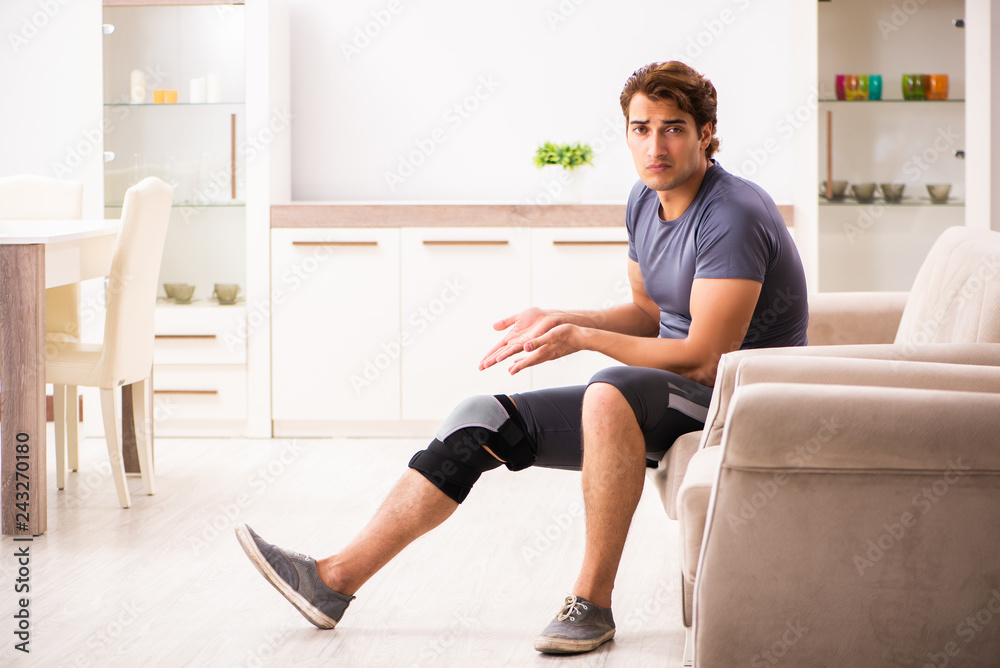 Man exercising for knee injury recovery Man exercising for knee injury recovery