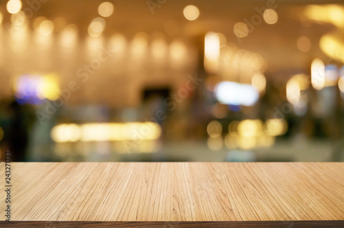empty wooden plank with blurred shopping mall background