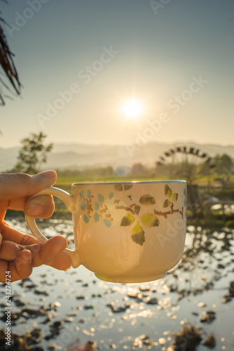 hot coffee cup with the beautiful nature in rural province