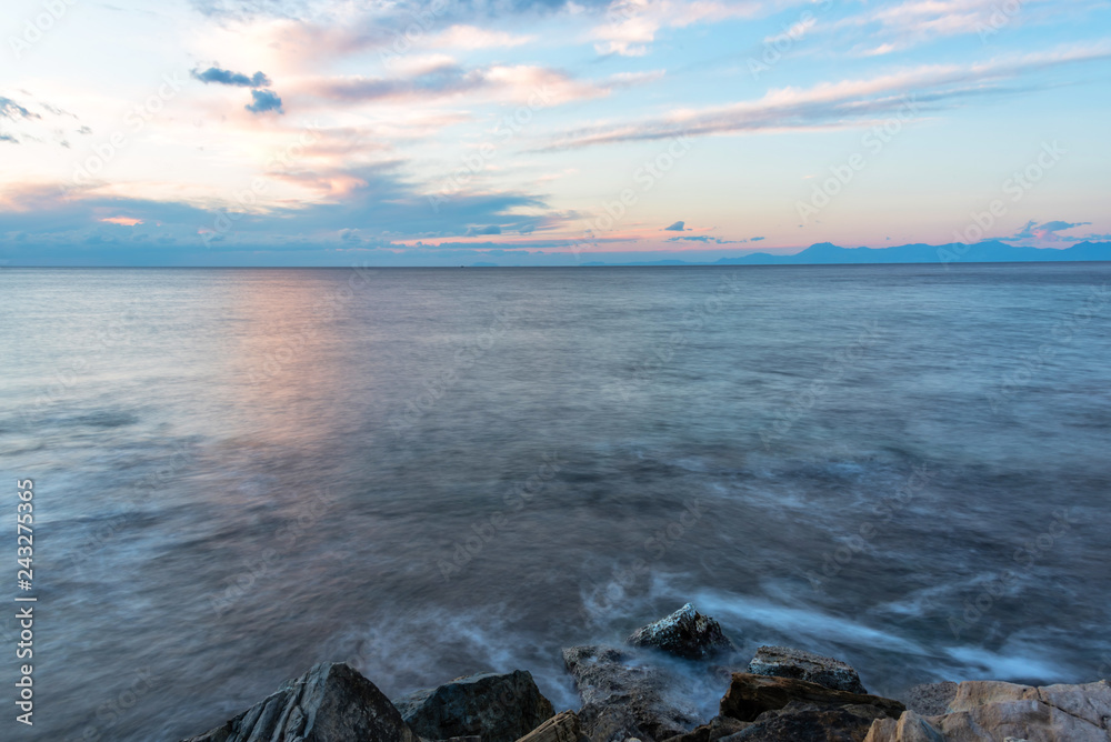 Long Exposure of the Mediterranean Sea Coast with Blue Sky in Southern Italy