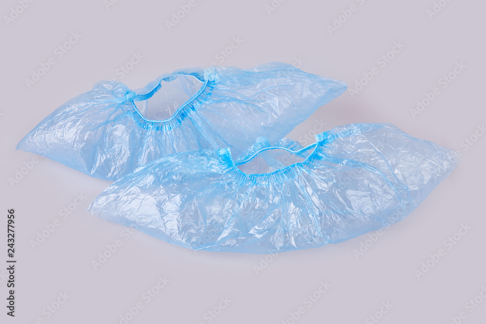 Obraz premium Blue overshoes (shoe covers) isolated on white background.