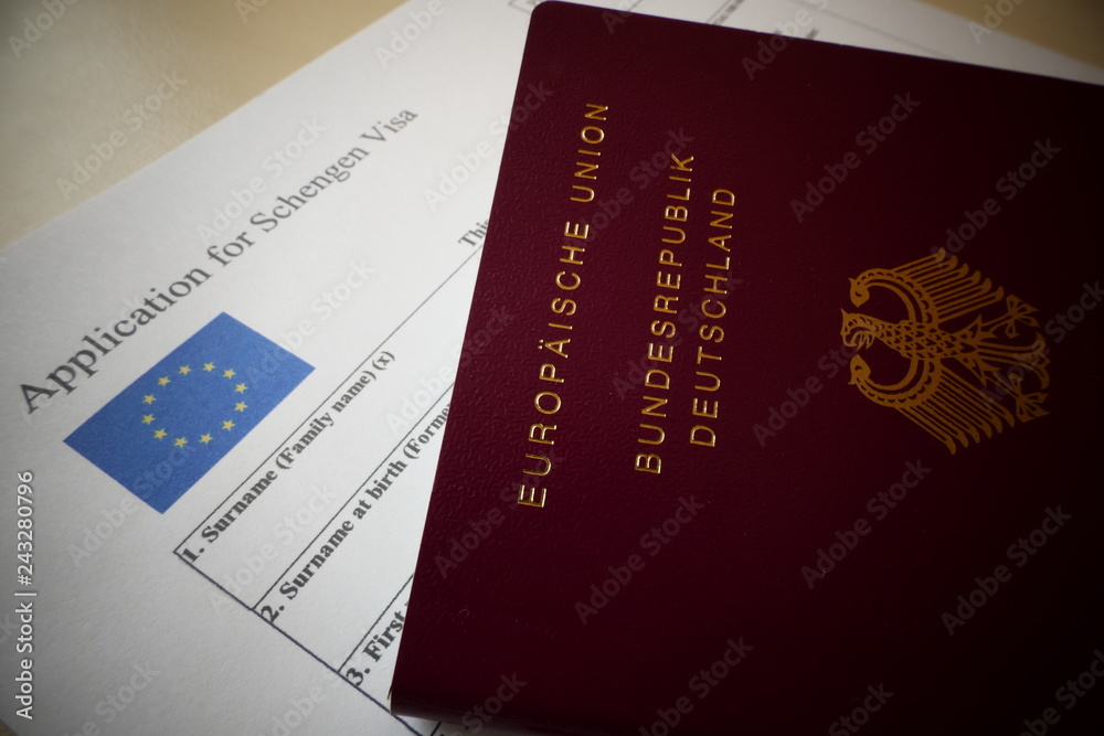 EU Schengen Visa application form with a german passport, a document For applying to entry in the European Union. EU Schengen Visa application form with a german passport, a document For applying to entry in the European Union.