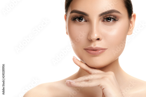 The beautiful female face. The perfect and clean skin of face on white