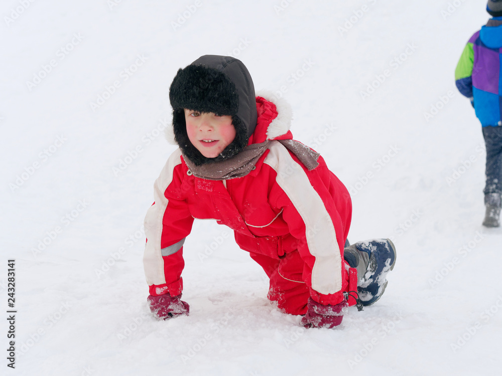 Winter fun. children ride from a snow hill. Winter fun. children ride from a snow hill.