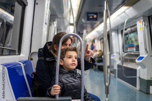 Canvas Print Mother and son travelling on the subway