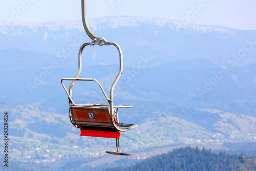 Empty old ski elevator chair close up.