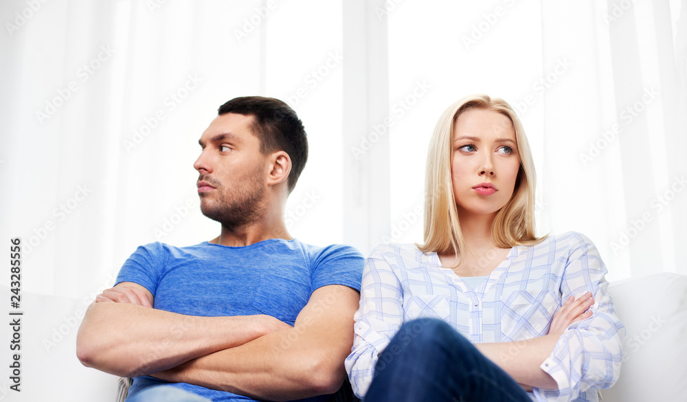 people, relationship difficulties, conflict and family concept - unhappy couple having argument at home