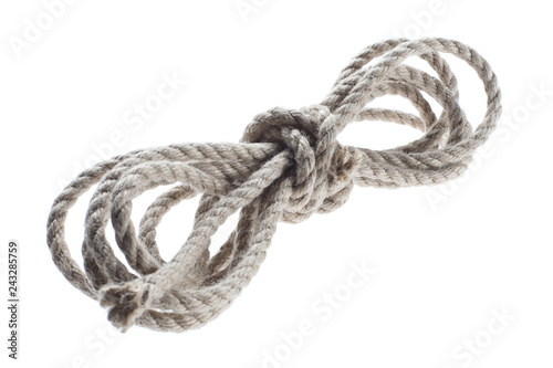 Roll of thin natural rope, isolated on white background