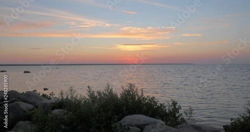 Time lapse of a warm sunset on a calm sea