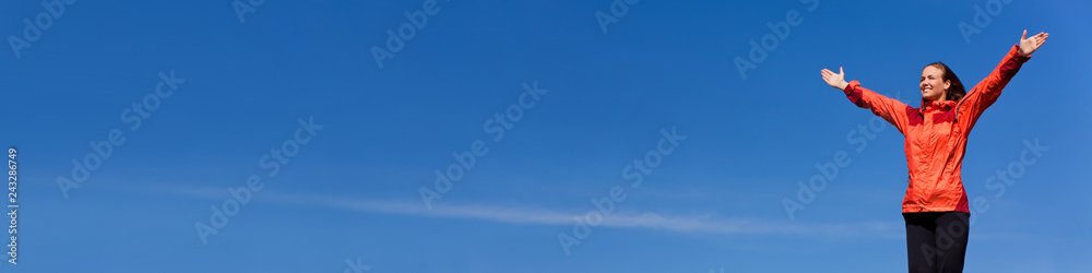 Woman Celebrating Arms Raised In Blue Sky Panorama Woman Celebrating Arms Raised In Blue Sky Panorama