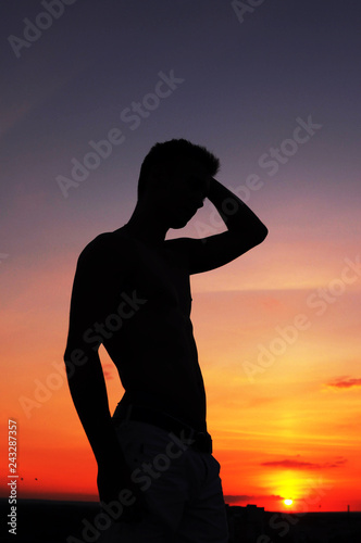 Silhouette of a guy at sunset