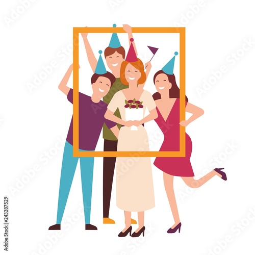 Group of friends wearing cone hats celebrating birthday and holding portrait ...