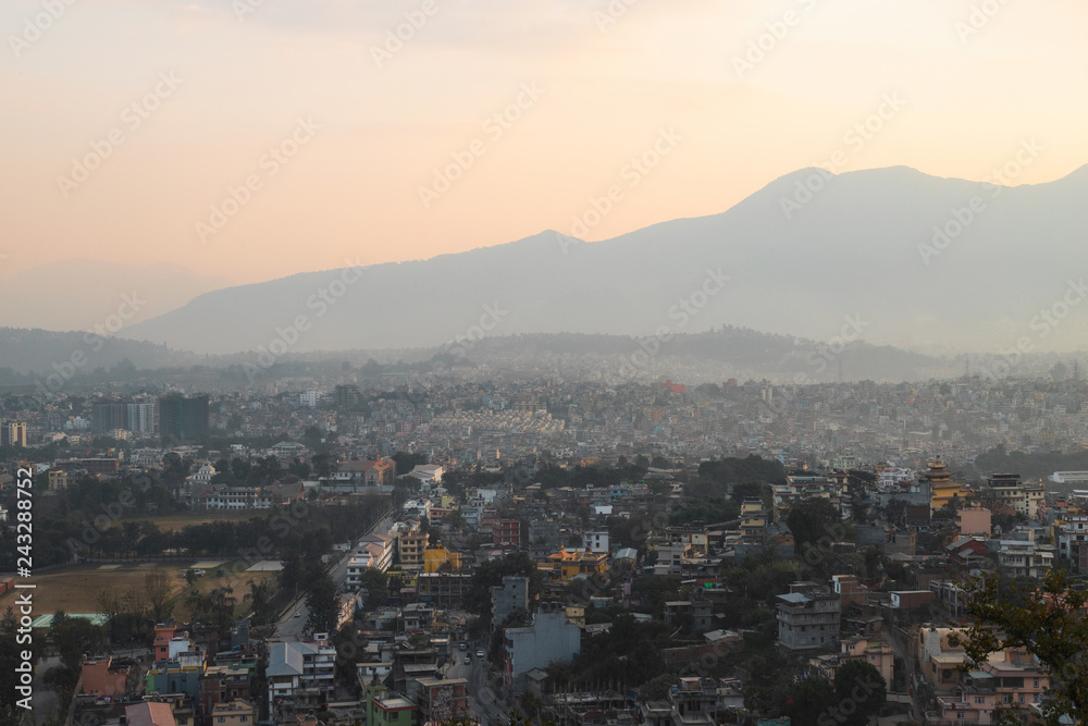 Sunset view of Kathmandu city with mountain on the background.