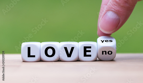 Is there love? Hand turns a dice and changes the word "no" to "yes" (or vice versa)