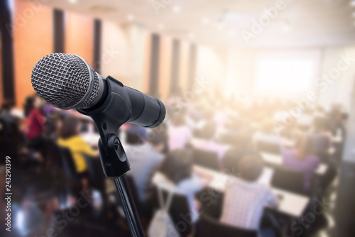 Microphone over the blurred business people forum Meeting or Conference Training Learning Coaching Room Concept, Blurred background.